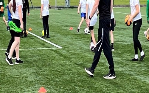 children playing football