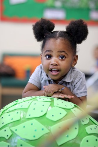 girl and arty green ball